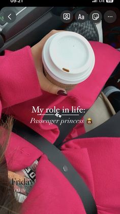 a person holding a coffee cup in their hand and wearing a pink jacket with the words, my role in life passenger princess