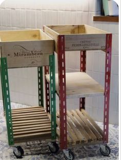 two wooden crates sitting on top of a tiled floor