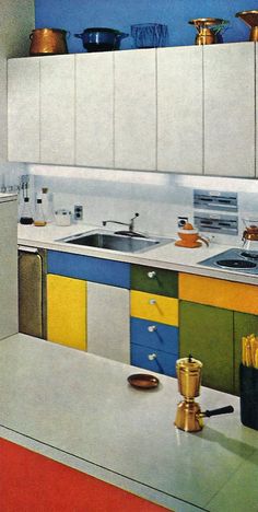 a kitchen with white cabinets and colorful counter tops on the counters is pictured in this painting