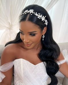 a woman in a wedding dress wearing a tiara