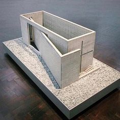 a model of a building on display in a room