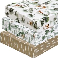 two boxes are stacked on top of each other with deer and pine trees printed on them