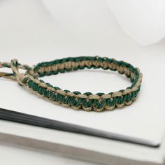 Embrace earthy tones with this handmade sage green hemp bracelet. Perfect for surfers and boho lovers, it’s crafted from natural eco-friendly materials. This adjustable bracelet offers a relaxed beach style, ideal for casual wear or gifting someone special who loves nature-inspired, sustainable fashion.Material: natural hempWidth: about 1/2 inch (10-12cm)Color: Sage green and naturalLength: 6 inch or custom Closure: braided loop and ties closure, make the bracelet more adjustable . If you want y Hemp Bracelet, Hemp Bracelets, Earthy Tones, Adjustable Bracelet, Beach Style, Boho Jewelry, Nature Inspired, Sage Green, Sustainable Fashion