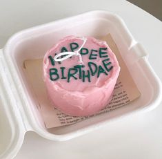 a pink cupcake with the words appee birthday written on it