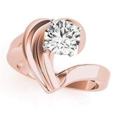 a rose gold ring with a diamond in the center and two curved bands around it