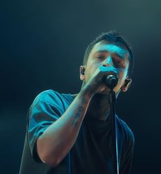 a man holding a microphone up to his mouth