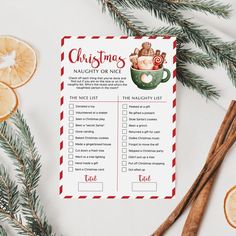 a christmas list with orange slices and cinnamons around it on top of a table