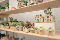 many small houses and trees are on shelves