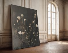 an empty room with a large painting on the wall