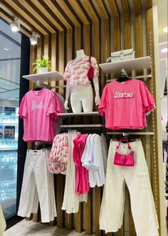 clothes are displayed on shelves in a store