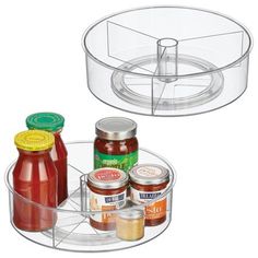 two clear containers with sauces and condiments in them on a white background