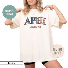 a woman is posing with her arms behind her back and the words apri printed on it