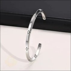 This slick stainless-steel cuff is the accessory that completes any look. The bold, open design makes a contemporary statement whether you're a style trailblazer or a more understated dresser. Show off your sporty side and add polish to any ensemble with this versatile steel stunner.   Specifications: Metal : Stainless Steel  Color : Stainless Steel  Finish : Polished  Total  Weight : 20g  Dimensions : 0.16" | 4mm  Diameter : 2.51" | 64mm   Brothers in arms,   BERML  offers you the war-ready sta Modern Silver Stainless Steel Cuff Bracelet, Modern Metal Cuff Bracelet, Modern Stainless Steel Bangle Cuff Bracelet, Modern Cuff Bangle Bracelet, Modern Stainless Steel Bangle, Modern Adjustable Cuff Bracelet, Modern Metal Cuff Bangle, Modern Silver Metal Cuff Bracelet, Modern Silver Open Cuff Bangle