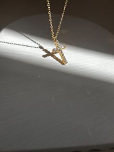 This cross necklace is adorned with dainty crystals. Wear as an everyday necklace, it also is great for layering with other necklaces.  FYI-Our founder took this to Jamaica on vacation, swam through salt water and pools with chlorine and it's still looks good as new! ✨✨ The Urban Bloom Jewelry Co Cross Pendant Necklace  -18k plated over Sterling silver -Pendant Size: Length 17mm/0.66inch  -Chain length: 41cm+(5cm extension) -Weight- 2g -Waterproof  -Every item comes in a custom box and gift wrap Crucifix Cross Necklace With Clavicle Chain As Gift, Gift Crucifix Necklace With Clavicle Chain, Gift Cross Pendant Necklace With Clavicle Chain, Gift Cross Necklace With Clavicle Chain, Crucifix Necklace With Adjustable Chain For Gift, Cross Necklace With Adjustable Chain Crucifix As Gift, Crucifix Cross Necklace With Adjustable Chain As Gift, Crucifix Cross Necklace With Adjustable Chain, Spiritual Cross Necklace With Adjustable Chain As Gift