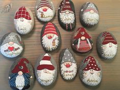 painted rocks with gnomes on them are arranged in a circle to spell out names