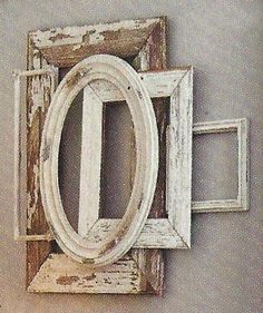 an old window frame hanging on the wall