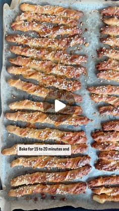 an image of baked bread sticks being cooked on a baking sheet with salt sprinkled on top