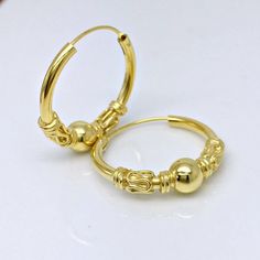 Yellow gold plated extra large hoop earrings.  These extra large wire hoop earrings are handmade from high quality sterling silver. Sold as a pair or as a single earring.Base metal:  solid high quality 925 sterling silverOuter plating:  yellow goldInner diameter: 16mmOuter diameter: 20mmEar Post: 20 gauge, normalMeasurements are an approximation.Thank you for your interest in our large wire hoop earrings. Adjustable Gold Plated Hoop Jewelry, Adjustable Gold-plated Hoop Jewelry, Classic Gold Hoop Cartilage Earrings, Hypoallergenic Gold Plated Hoop Jewelry, Hallmarked Hoop Metal Jewelry, Handmade Adjustable 14k Gold Hoop Earrings, Handmade Yellow Gold Round Huggie Earrings, Adjustable Handmade 14k Gold Hoop Earrings, Adjustable Gold Hoop Jewelry