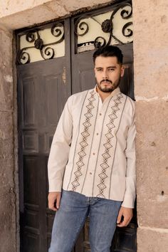 This beautiful Traditional Guayabera for Men has an ethnic embroidered design and adds a modern and sophisticated flare to your wardrobe.  It is made out of fine Mexican cotton and is completely embroidered by artisanal Machine- hand manipulated. This elegant long sleeve button up Shirt is perfect for special occasions such as Mexican Fiestas, Quinceañeras, Weddings, etc. This guayabera is made by Mexican Artisans in Chiapas, Mexico. Traditional Wedding Wear With Woven Motifs And Long Sleeves, Traditional Long Sleeve Wedding Wear With Woven Motifs, Traditional White Shirt With Chikankari Embroidery, Traditional Long Sleeve Shirt, Traditional Long Sleeve Shirt With Intricate Embroidery, Traditional Long Sleeve Shirt With Patterns, Traditional Fit Embroidered Shirt, Traditional Long Sleeve Wedding Shirt, Mexican Fiesta Wedding