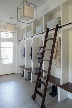 a ladder is in the middle of a walk - in closet