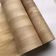 two rolls of wood paper on top of each other