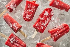 watermelon popsicles are sitting on top of ice