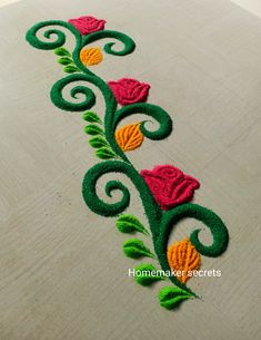 a close up of a flower design on a wooden surface with the words homemaker secrets written below it