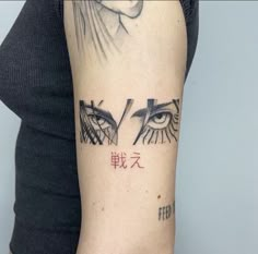 a woman's arm with an eye tattoo on the left side of her arm