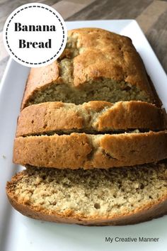 a loaf of banana bread sitting on top of a white plate