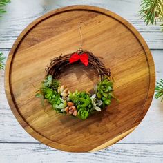 a wooden tray with a wreath on it