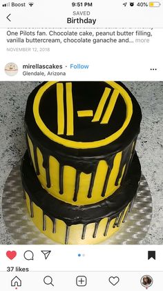 a three layer cake with yellow and black icing