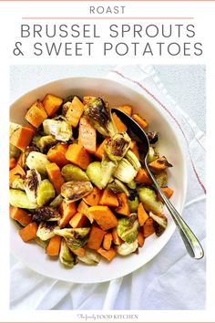 a white bowl filled with brussel sprouts and sweet potatoes next to a spoon