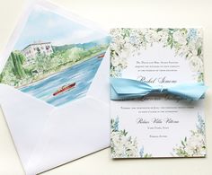 an open envelope with a watercolor painting of a boat on the river and a blue bow tie