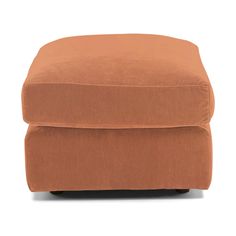 the footstool is made out of fabric and has a brown cushion on it