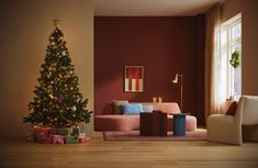 a living room with a christmas tree in the corner and presents on the floor next to it