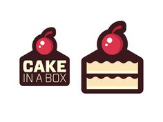 two pieces of cake with cherries on top and the words cake in a box