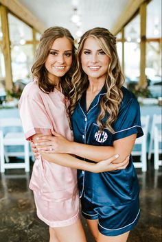 two beautiful young women standing next to each other