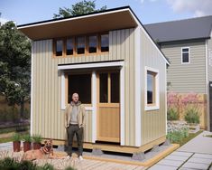 a man standing in the doorway of a tiny house with his dog on the porch