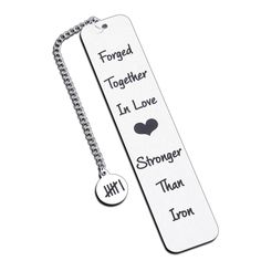 a bookmark with two different words on it and a key chain attached to it