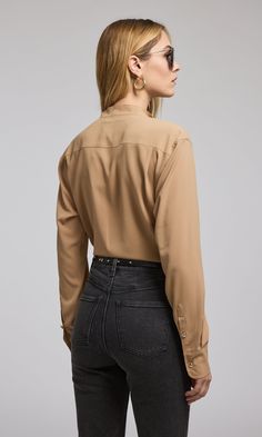 100% polyester Unlined Hand Wash, Hang to dry or cool iron as needed Relaxed Fit Length: 24 1/2" Gold Crystal Rim Button Style: W00864009 Model Size & FitModel wears a size XSModel's height: 5'10”/177cm Classic Brown Blouse For Work, Classic Brown Blouse With Button Closure, Brown Spread Collar Blouse For Work, Classic Brown Blouse With Button Cuffs, Classic Fitted Brown Blouse, Beige Blouse With Spread Collar For Work, Fall Fitted Blouse With Concealed Placket, Fitted Blouse With Concealed Placket For Fall, Button Style