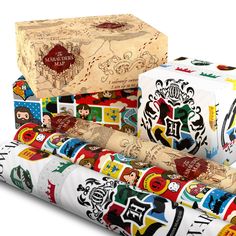 several rolls of wrapping paper are stacked on top of each other with harry potter stickers all over them