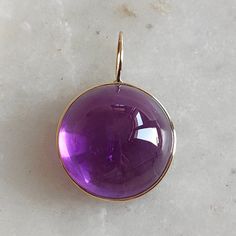 This stunning Pendant is set in 14k Solid Yellow Gold with Natural Purple Amethyst with utmost precision. It is a unique gemstone Pendant for nearly every occasion and is completely hassle-free jewelry. ITEM DETAILS: * Gem: Purple Amethyst * Gem Size: 19x19mm * Gem Shape: Round Fix Loop * Gem Weight: 24.80 carats * Gold Purity: 14KT  * Gold Weight: 0.39 gram * Total Weight of the Pendant: 5.35 gram The Gold purity is guaranteed and it comes with authentic 14KT gold hallmark. Since my items are h Gold Necklace Pendant, Handmade Jewelry Box, Higher Consciousness, Amethyst Gem, Bezel Pendant, Spiritual Awareness, February Birthstone, Amethyst Pendant, Unique Gemstones