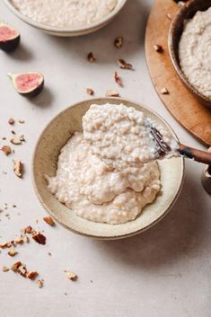 a bowl filled with oatmeal next to two bowls full of oatmeal