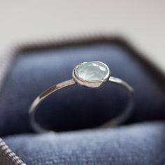 Skinny stackable ring with beautiful oval Aquamarine stone. The ring is made with a skinny but sturdy band, which allows you to create mind-blowing stacking sets! It is ideal for everyday wear and it will also look amazing with a festive dress. The stone is 6x4mm. The ring is 1 mm thick and looks very dainty on the finger. If you want to change the ring band design or get a custom ring or ring sets, feel free to contact me. You can choose for the ring to be made in sterling silver or 9k gold. If Everyday Oval Gemstone Stackable Rings, Everyday Oval Stackable Rings With Birthstone, Minimalist Oval Stackable Birthstone Ring, Adjustable Stackable Oval Birthstone Ring, Dainty Oval Crystal Ring, Stackable, Dainty Oval Stackable Birthstone Ring, Dainty Oval Crystal Ring Stackable, Dainty Oval Crystal Stackable Ring, Oval Stackable Birthstone Promise Ring