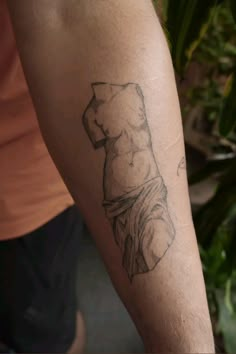 a person with a tattoo on their arm