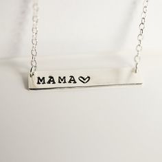 Sterling silver Mama Bar Necklace. Hand stamped personalized gold bar necklace with a gold filled chain is uniquely hand crafted for you in Melt'm Jewelry Studio in Redlands, California. Handmade from high-quality 14k Gold Filled, Silver or Rose Gold, this necklace features a stunning custom bar pendant that can be hand stamped with a name or meaningful message. Perfect for everyday wear or special occasions, this necklace is sure to become a cherished piece in any jewelry collection. Plus, it m Mother's Day Silver Bar Necklace With Name, Mother's Day Gift Bar Necklace, Engraved Bar Necklace For Mother's Day, Engraved Bar Necklace For Mother's Day Personalized Gift, Personalized Bar Necklace For Mother's Day, Silver Custom Name Bar Necklace For Anniversary, Customizable Rectangular Bar Necklace For Gifts, Customizable Rectangular Bar Necklace Gift, Hand Stamped Rectangular Necklaces For Mother's Day