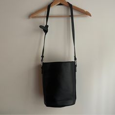 Never Used Classic Bucket Bag- Perfect Condition! Black Vegan Leather, Adjustable Strap, Fabric Lining. Interior Zipper And Open Pockets. Silvertone Hardware. Pet And Smoke Free Home. Height: 10" Width: 10" Base: 8" 6.5" Black Crossbody Bucket Bag For Everyday, Black Bag With Long Strap For Everyday Use, Black Everyday Bucket Bag, Black Bag With Long Strap For Daily Use, Black Bag With Long Strap For On-the-go, Black Bags With Snap Closure For Errands, Black Bucket Bag With Snap Closure, Black Shoulder Bag With Long Strap For Everyday, Black Leather Bag With Long Strap