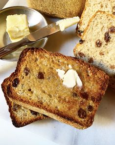 slices of bread with butter and raisins on them