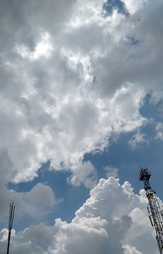 the sky is full of clouds and some antennas