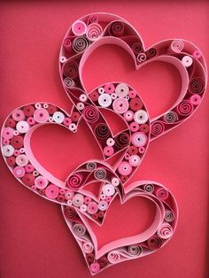 two hearts made out of paper and buttons